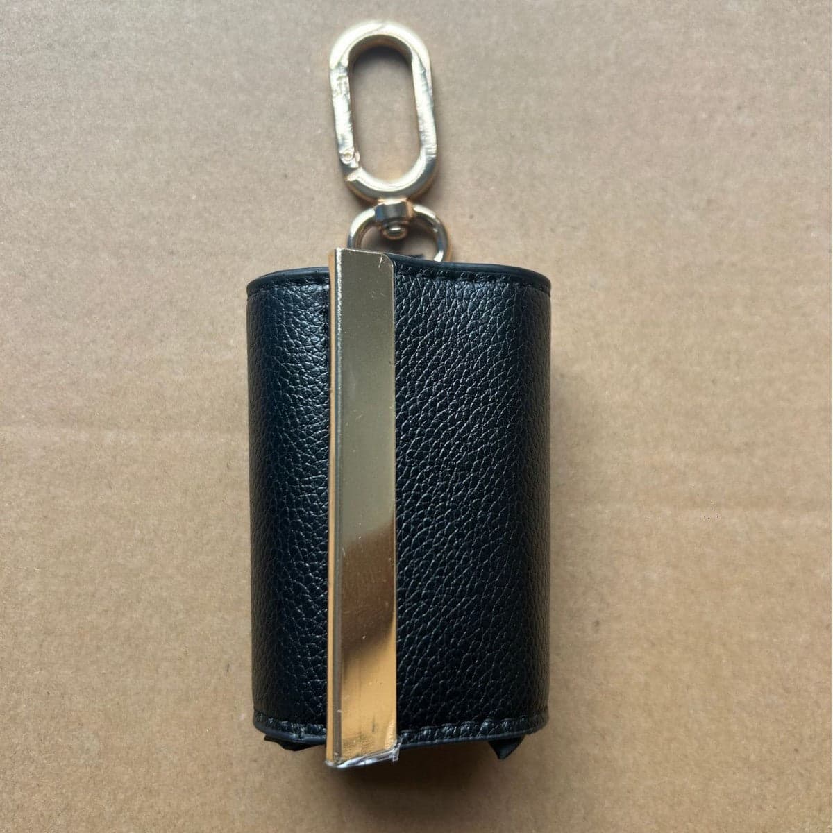 In a backpack — Flat against the back panel.
